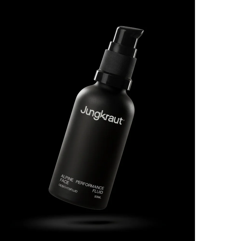 Schwarzes Jungkraut Gesichtsfluid für Männer mit Swiss NatureTECH® vor dunklem Hintergrund